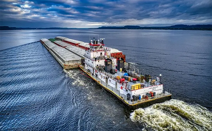 ingram barge on river cloudy