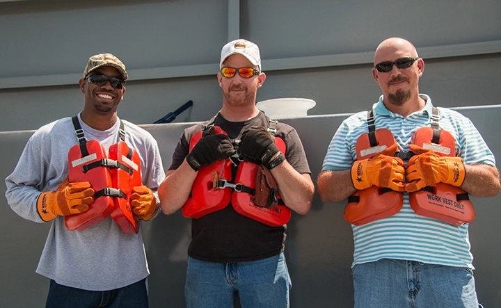 Three man wearing life jackets