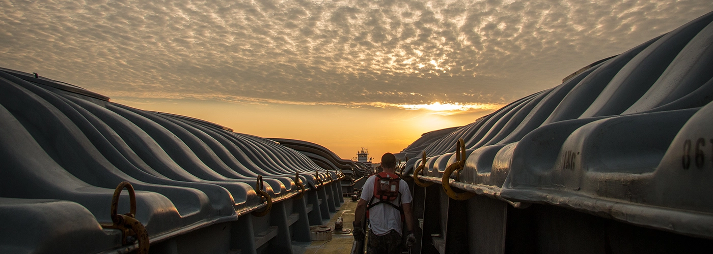 Man on Ingram ship with sunset